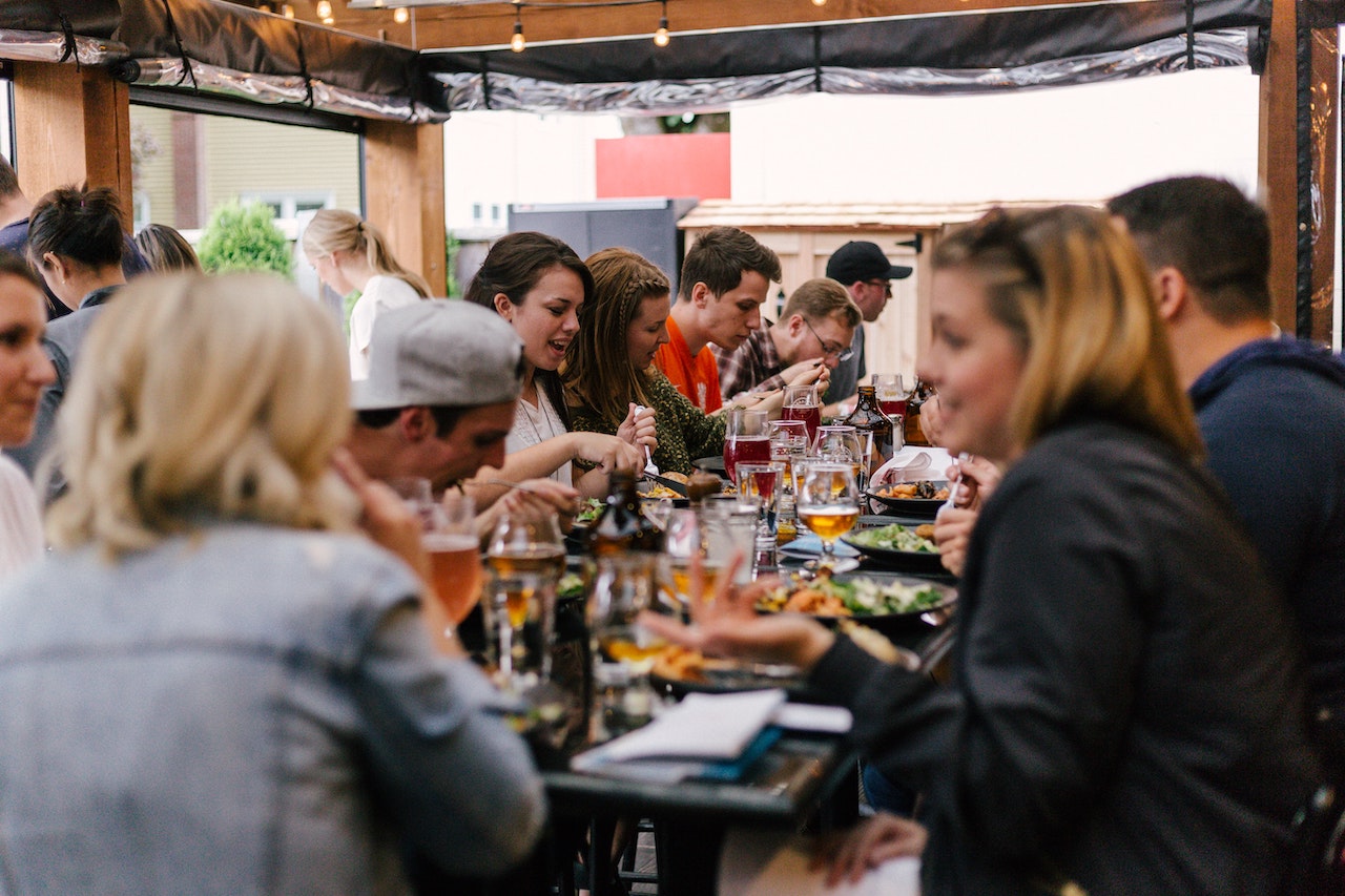 People eating at a restaurant to illustrate life outside of work.