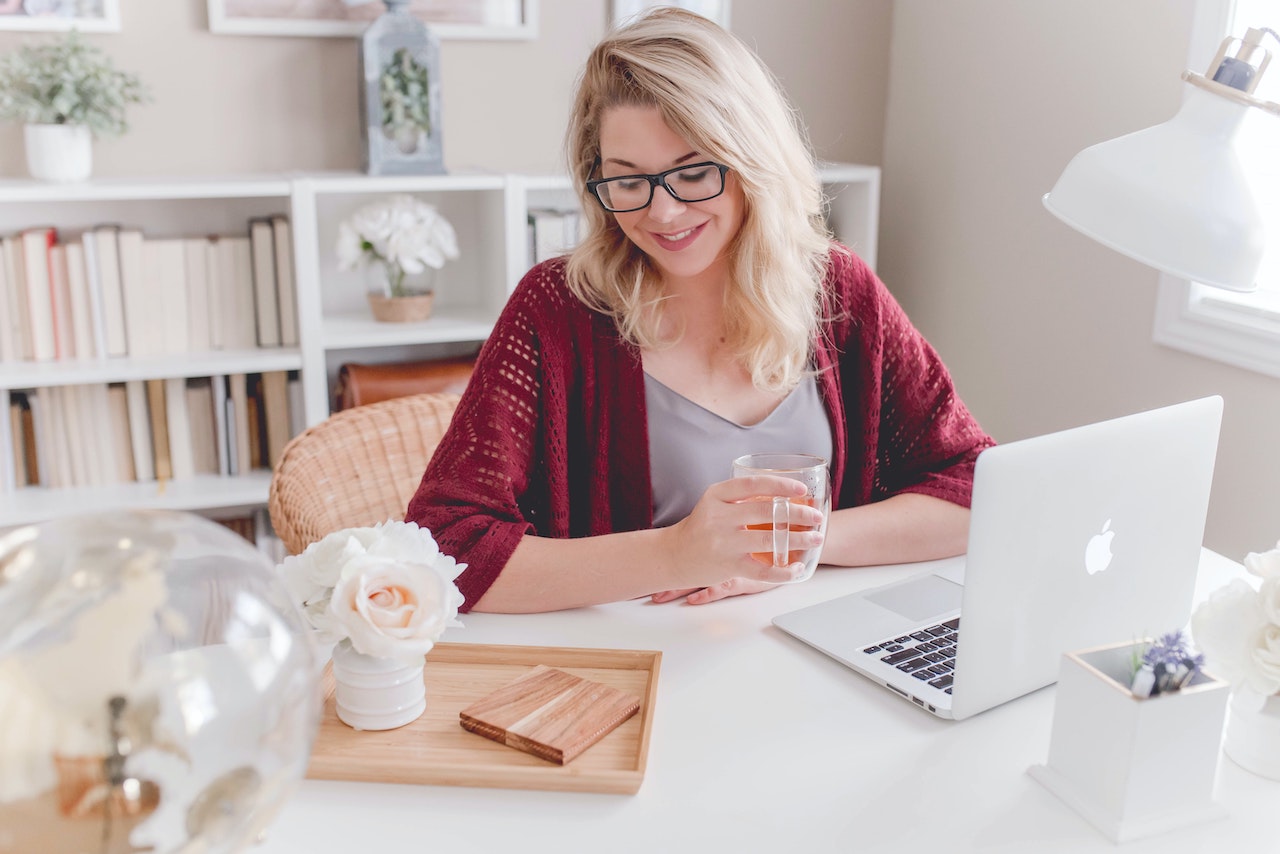 Woman looking down, illustrating article about why are you leaving your current job?