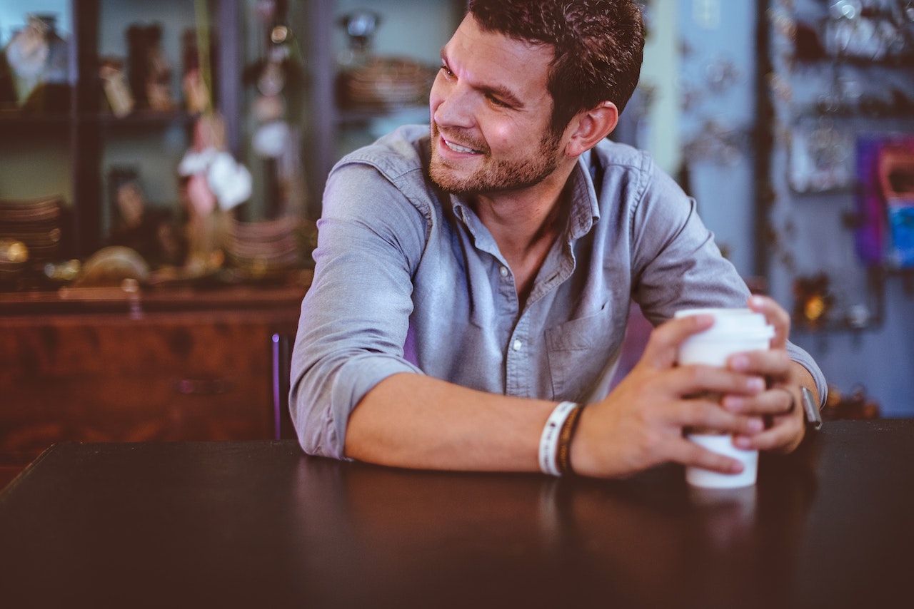 Man taking work break with coffee