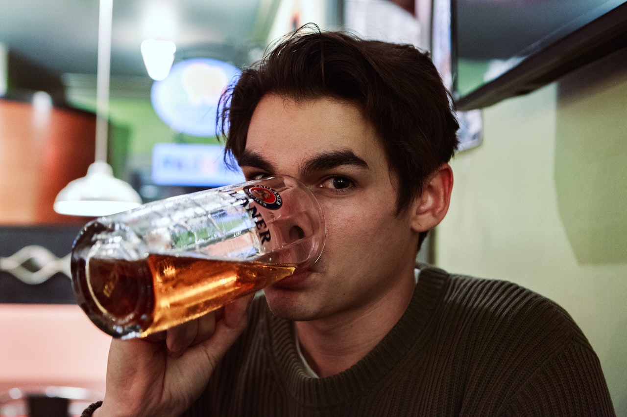Man drinking beer for story about alcohol at the workplace