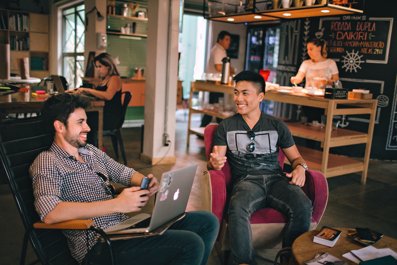 Two men smiling at work