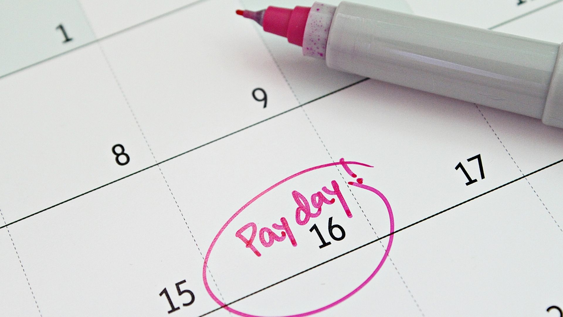 Photo of calendar and payday illustrating biweekly paycheck article.