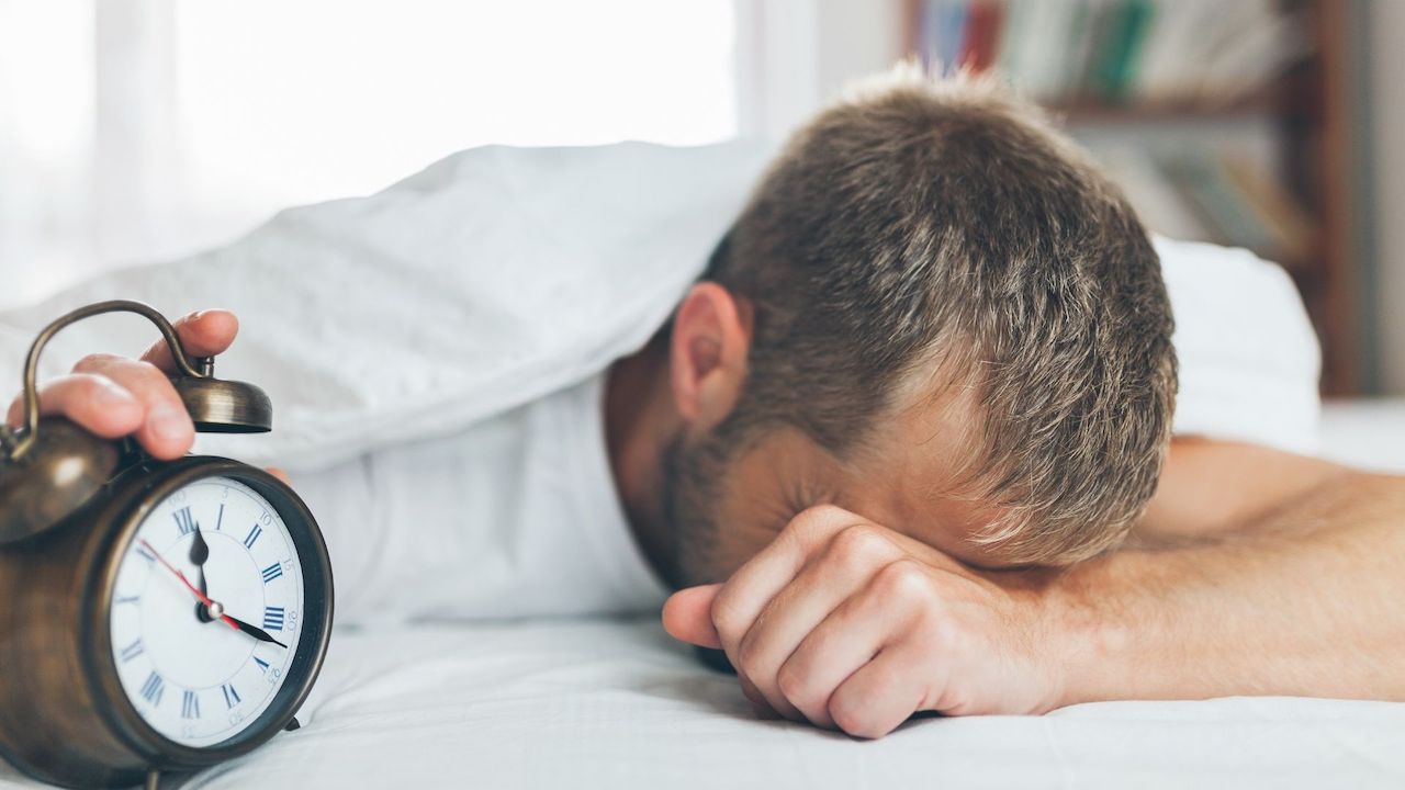 Photo of man sleeping, illustrating shift work.