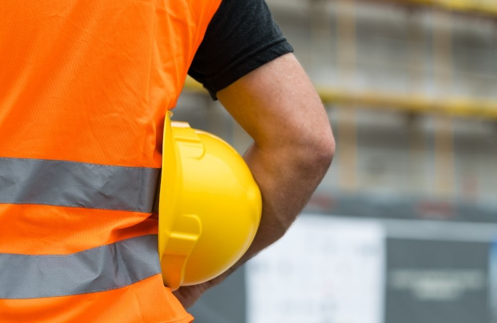 Photo of man with hardhat to illustrate safety training tips