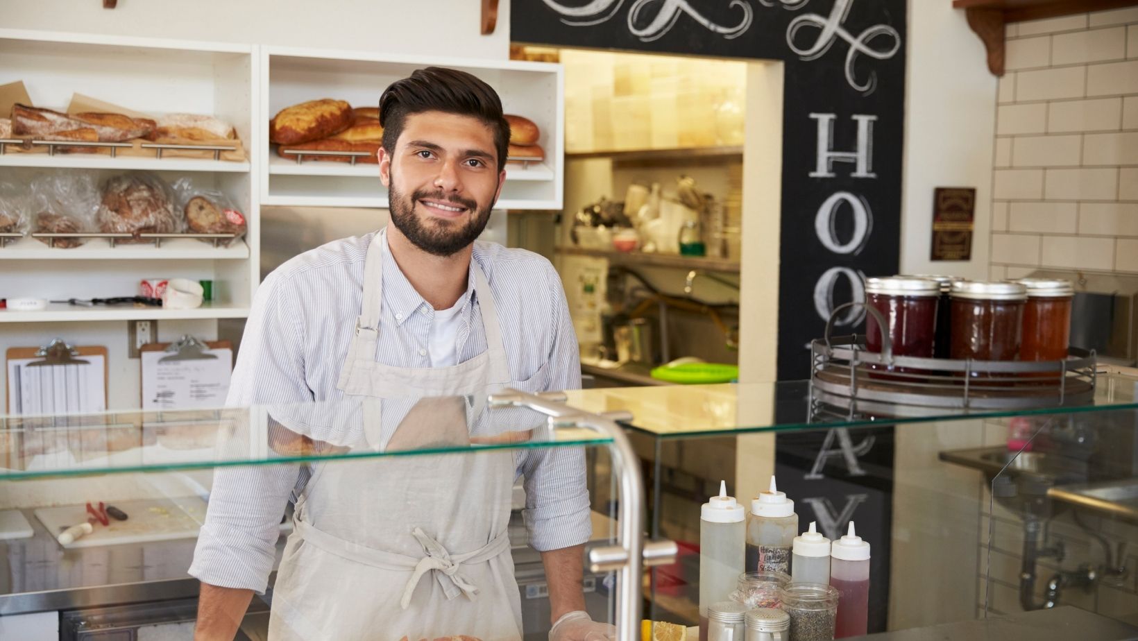 Man in shop illustrating small business tips.