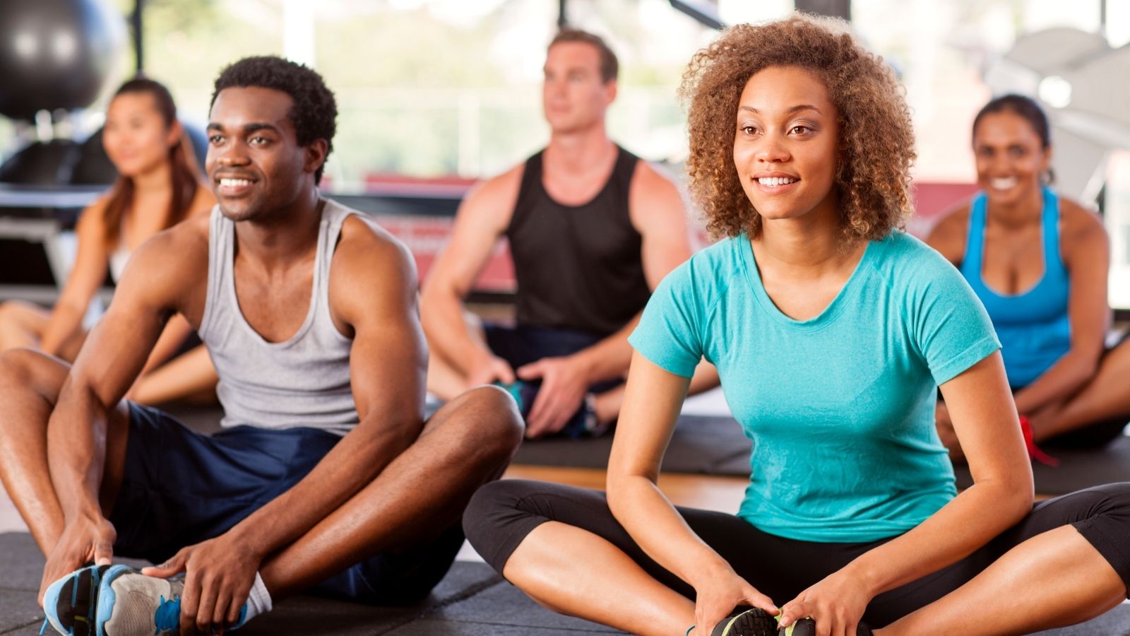 Photo of group fitness class to illustrate how to boost employee morale