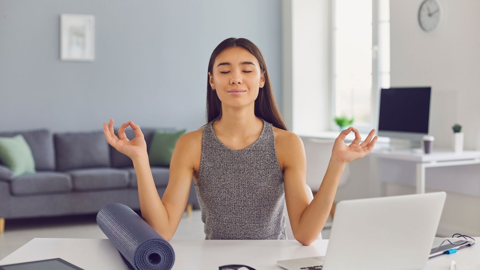 Work Life Balance Tips Photo of woman at computer illustrating Work Life Balance Tips