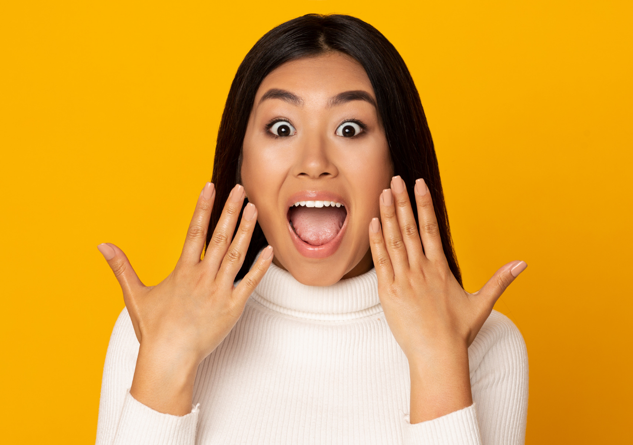 How to Wow Your Interviewer Photo of happy Asian woman to illustrate How to Wow Your Interviewer