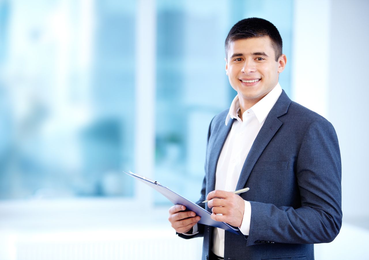 How to stand out during an interview Photo of man with clipboard to illustrate How to stand out during an interview
