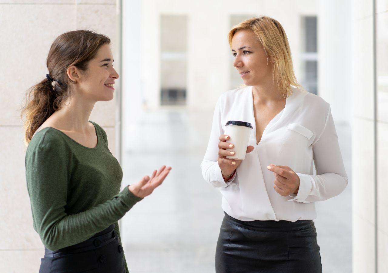 Photo of women talking to illustrate asking for references