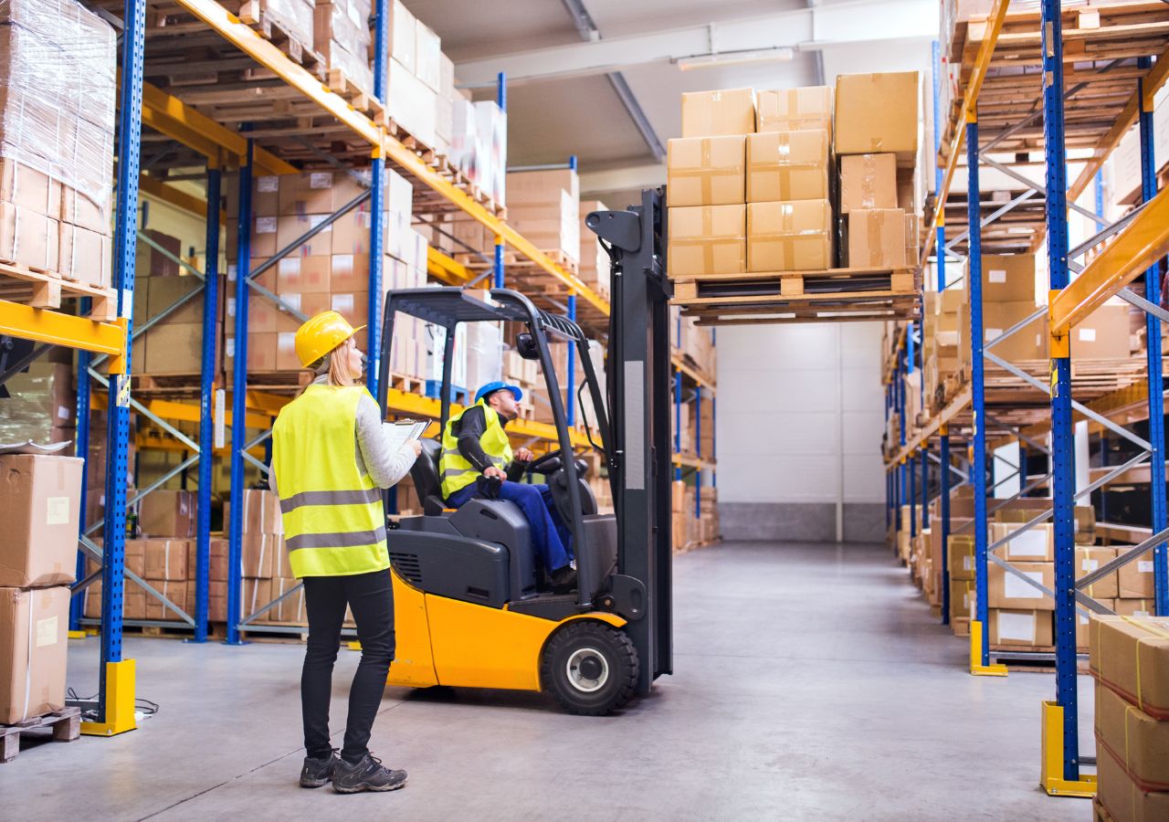 Photo of forklift worker to illustrate working in a warehouse
