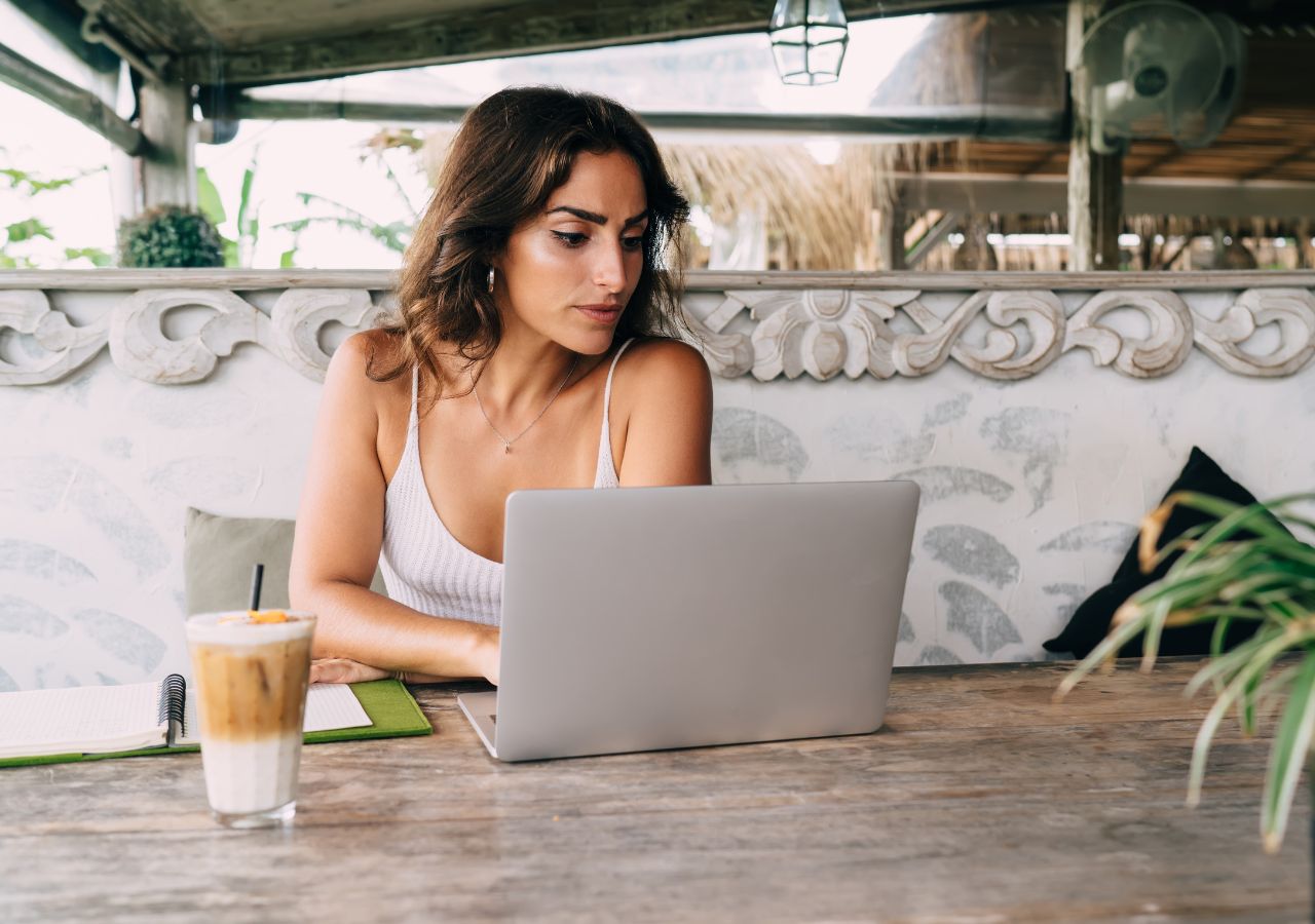 Photo of woman on a laptop computer to illustrate job hunting tips.