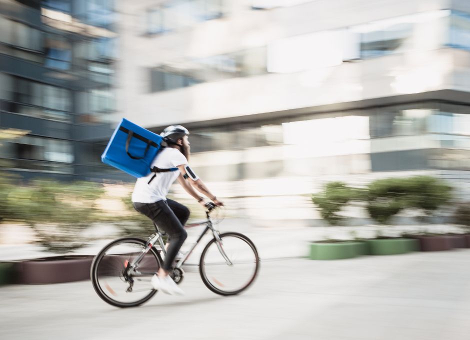 Photo of man delivering an item on his bike to illustrate contingent workers.