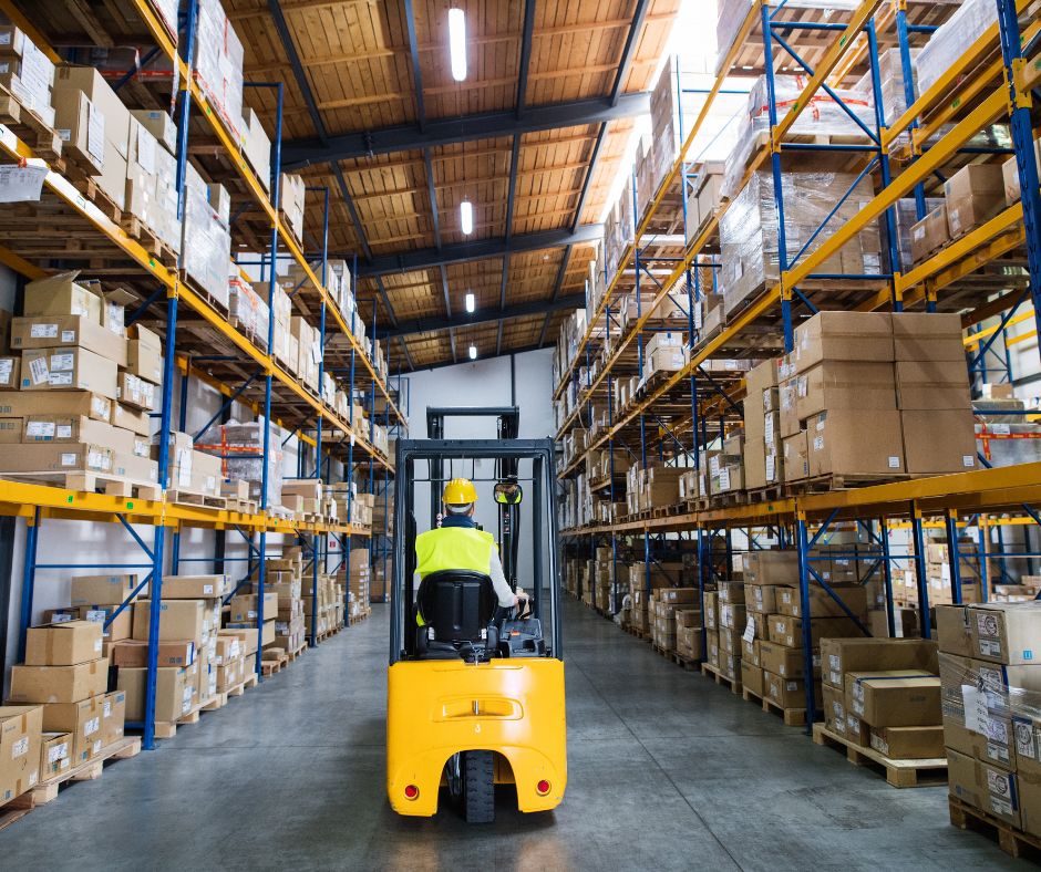 Photo of warehouse worker in forklift to illustrate why companies should enact a near miss program.
