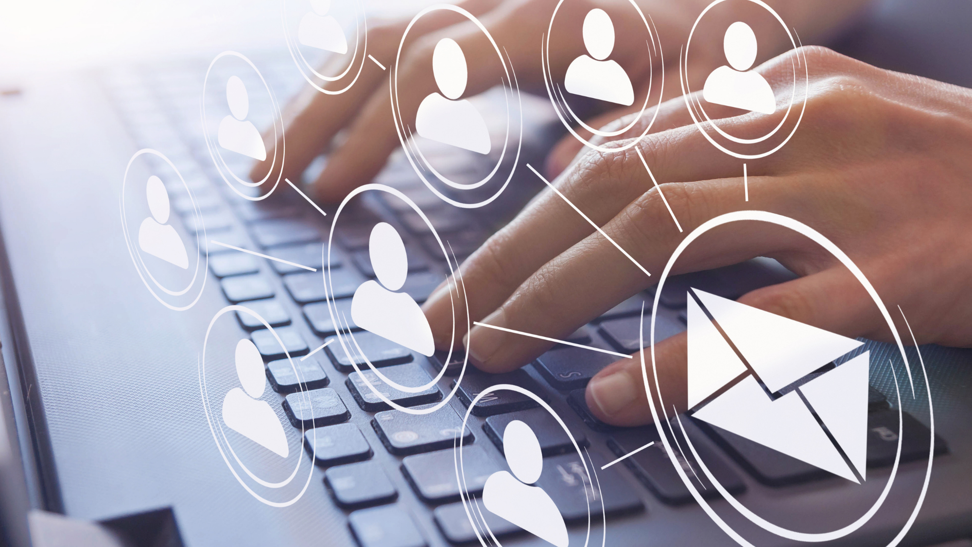 Close-up of hands typing on a laptop keyboard with digital icons representing people connected to an email symbol.